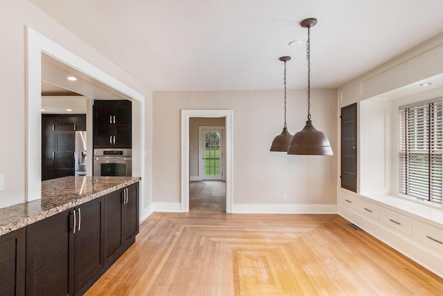 unfurnished dining area featuring baseboards