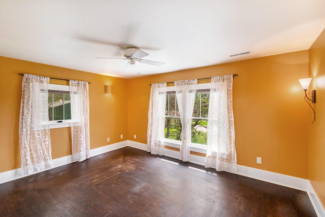 unfurnished room with visible vents, baseboards, ceiling fan, and a healthy amount of sunlight