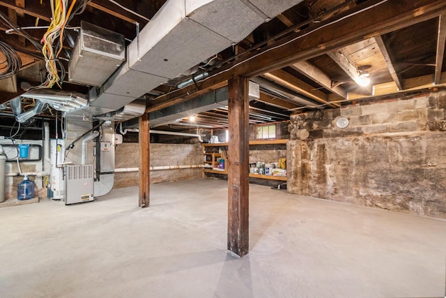 unfinished below grade area featuring heating unit