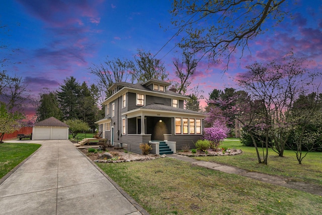 traditional style home with a garage, an outbuilding, and a front lawn
