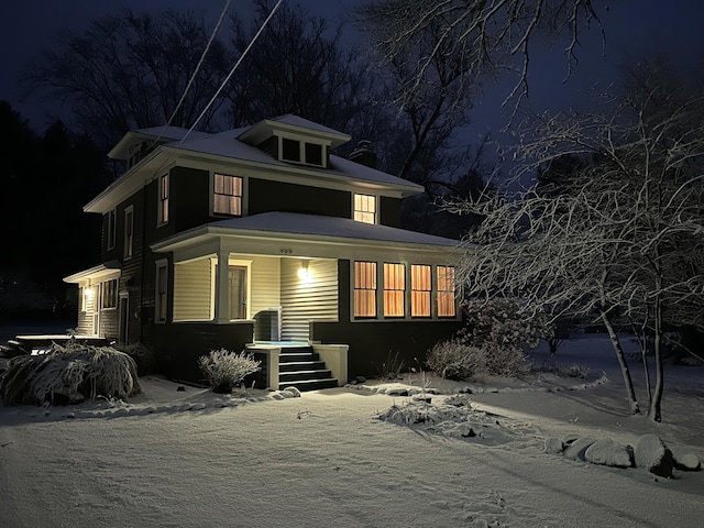 traditional style home featuring covered porch
