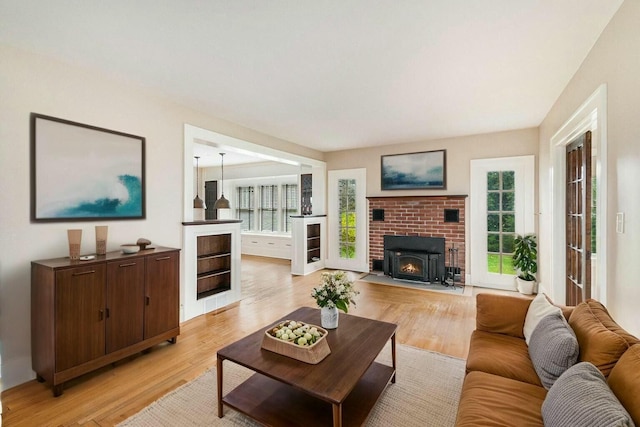 living room featuring a wealth of natural light and light wood finished floors