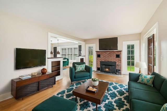 living room with plenty of natural light and light wood-style floors