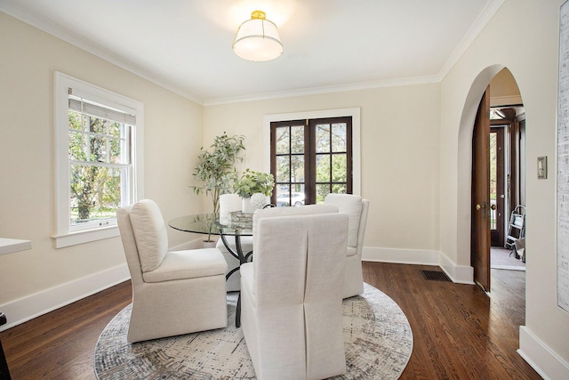 906 Granger Ave, Ann Arbor, MI 48104 - dining space with crown molding, arched walkways, and wood finished floors