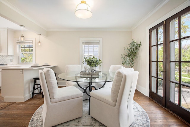906 Granger Ave, Ann Arbor, MI 48104 - dining area with baseboards, ornamental molding, and wood finished floors