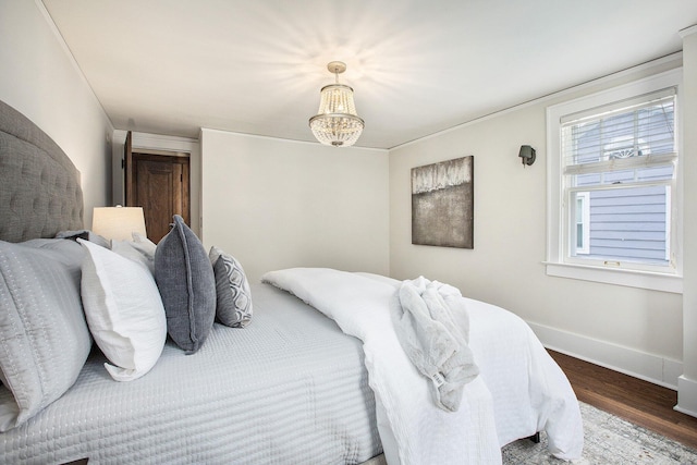 906 Granger Ave, Ann Arbor, MI 48104 - bedroom featuring baseboards and wood finished floors
