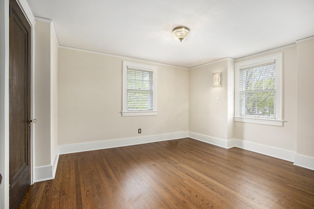906 Granger Ave, Ann Arbor, MI 48104 - spare room with baseboards, ornamental molding, and wood finished floors