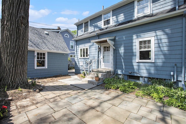 906 Granger Ave, Ann Arbor, MI 48104 - rear view of property with a patio area