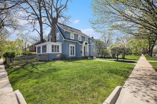 906 Granger Ave, Ann Arbor, MI 48104 - view of home's exterior with a lawn and fence
