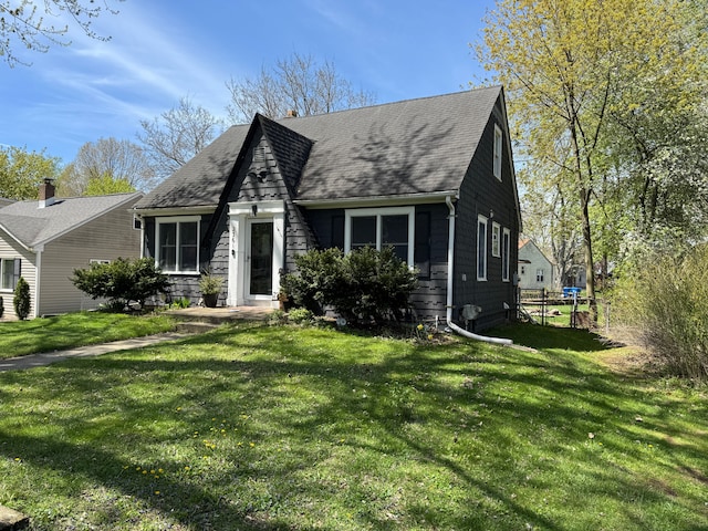 2361 Montroyal Ave, Waterford, MI 48328 - cape cod house featuring roof with shingles and a front lawn