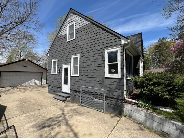 2361 Montroyal Ave, Waterford, MI 48328 - view of side of home featuring entry steps, an outdoor structure, and a garage