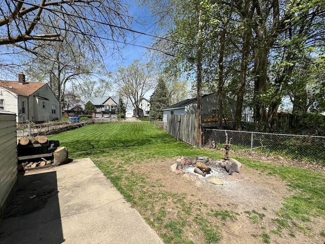 2361 Montroyal Ave, Waterford, MI 48328 - view of yard featuring fence, a fire pit, and a residential view