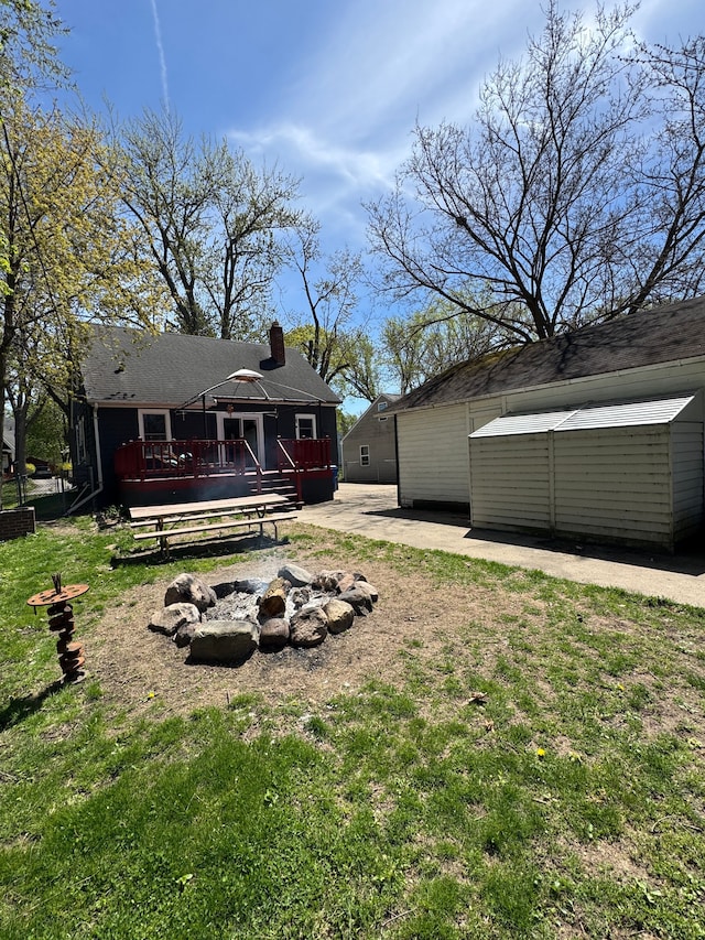 2361 Montroyal Ave, Waterford, MI 48328 - view of yard with a deck and an outdoor fire pit