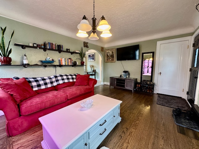2361 Montroyal Ave, Waterford, MI 48328 - living room featuring arched walkways, dark wood finished floors, a textured ceiling, and a notable chandelier