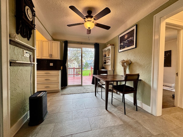 2361 Montroyal Ave, Waterford, MI 48328 - dining area with baseboards, a ceiling fan, a textured ceiling, and a textured wall