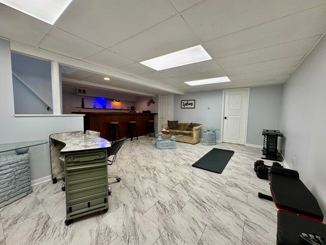 2361 Montroyal Ave, Waterford, MI 48328 - interior space featuring a bar, marble finish floor, a paneled ceiling, and baseboards
