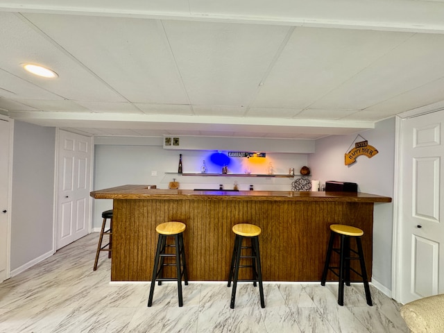 2361 Montroyal Ave, Waterford, MI 48328 - bar with baseboards and indoor bar