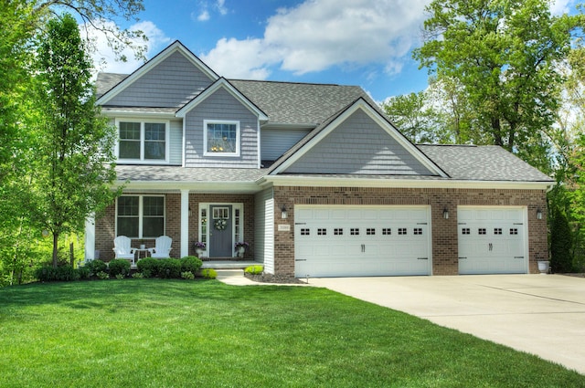 3088 Painted Dr, Howell, MI 48843 - craftsman inspired home featuring covered porch, an attached garage, concrete driveway, a front yard, and brick siding