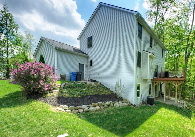 3088 Painted Dr, Howell, MI 48843 - view of home's exterior with central AC, a deck, and a lawn