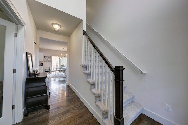 3088 Painted Dr, Howell, MI 48843 - stairs featuring wood finished floors, a chandelier, and baseboards