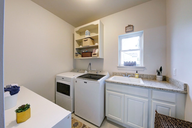 3088 Painted Dr, Howell, MI 48843 - clothes washing area featuring washing machine and dryer, cabinet space, and light tile patterned floors