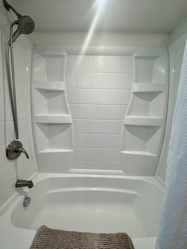 bathroom with shower / bath combo