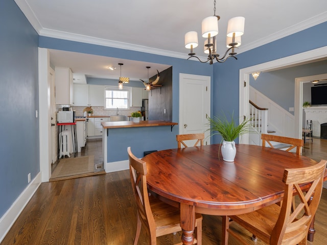 dining space with crown molding, a notable chandelier, stairs, baseboards, and dark wood-type flooring