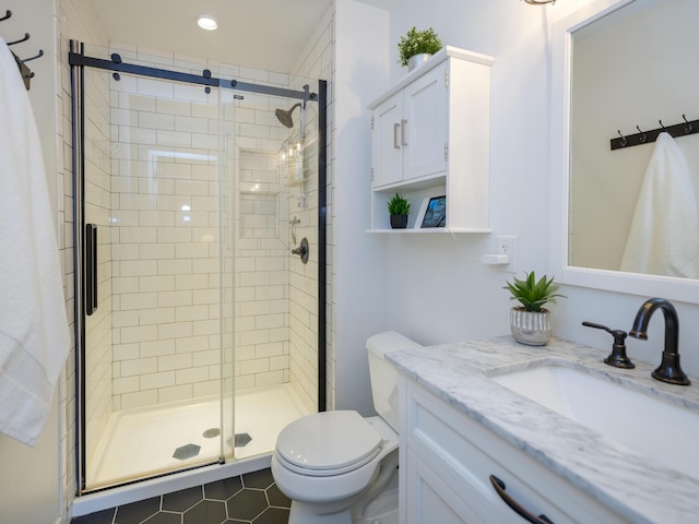 full bathroom featuring recessed lighting, vanity, a shower stall, and toilet