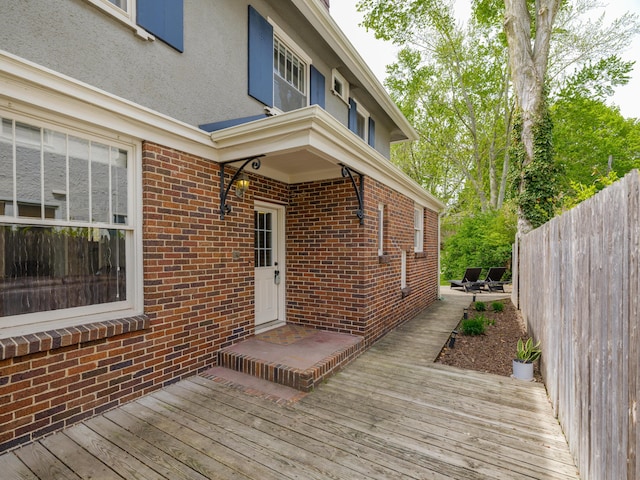 wooden deck featuring fence