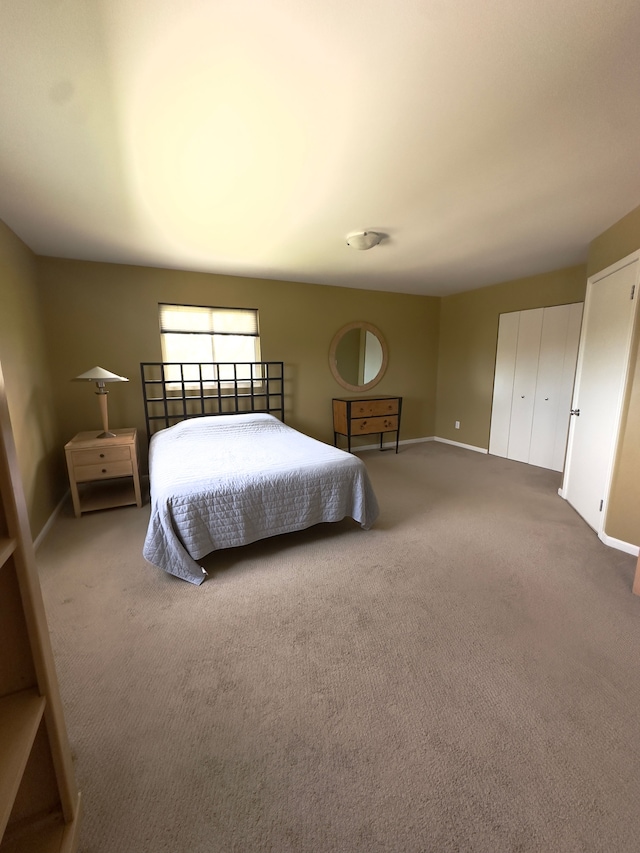 carpeted bedroom with baseboards