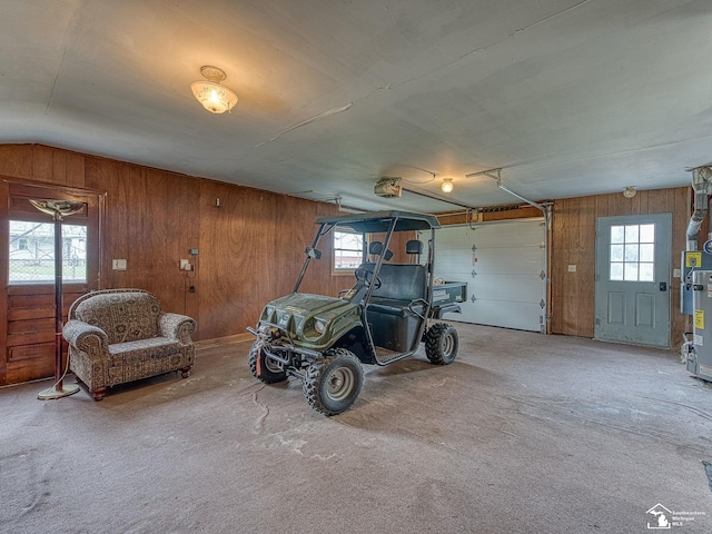 garage with wooden walls and a garage door opener