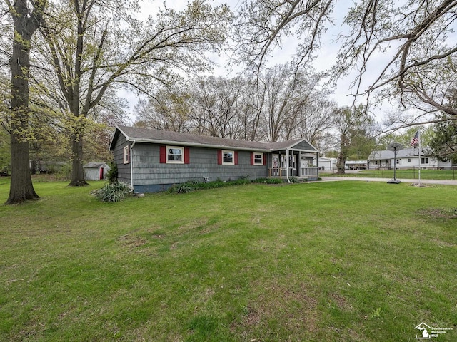 ranch-style home featuring a front yard