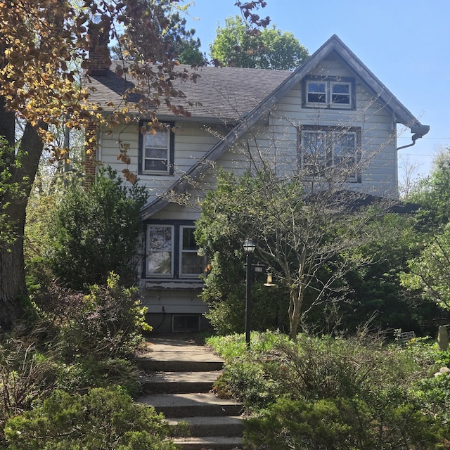 view of front facade featuring a chimney