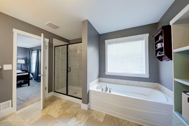 full bath featuring ensuite bathroom, a stall shower, a bath, and visible vents