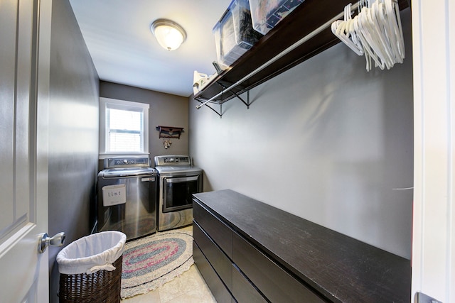 laundry room featuring laundry area, light tile patterned floors, and washer and dryer