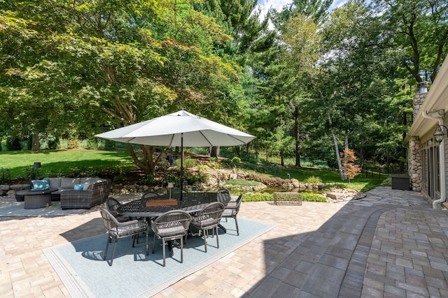 view of patio with outdoor lounge area and outdoor dining space