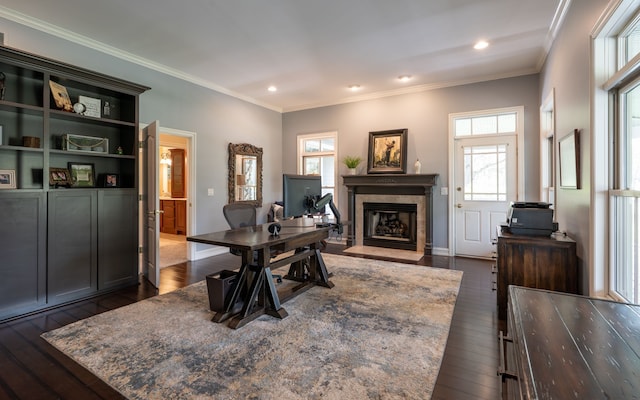 home office featuring ornamental molding, recessed lighting, dark wood-style flooring, a premium fireplace, and baseboards