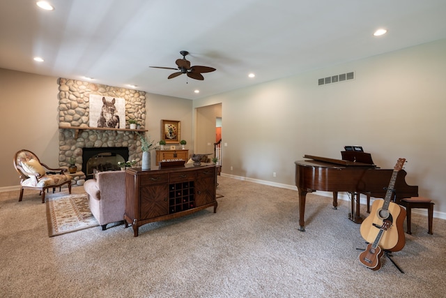 living room featuring carpet flooring, a ceiling fan, visible vents, and recessed lighting