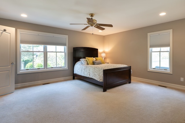 bedroom with recessed lighting, visible vents, baseboards, and light carpet
