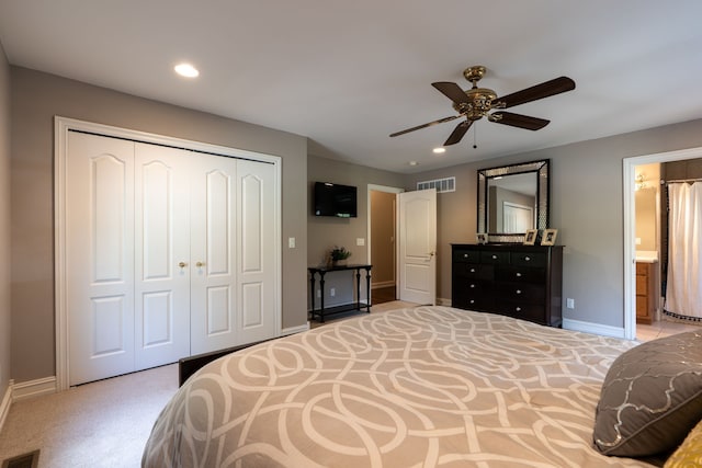 bedroom featuring a closet, visible vents, baseboards, and carpet floors
