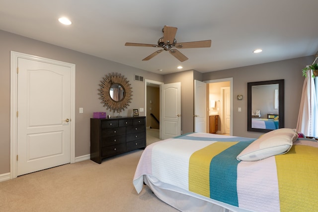 bedroom with ensuite bathroom, visible vents, recessed lighting, light carpet, and baseboards