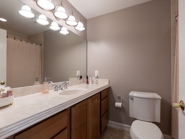 full bathroom featuring tile patterned floors, toilet, baseboards, and vanity