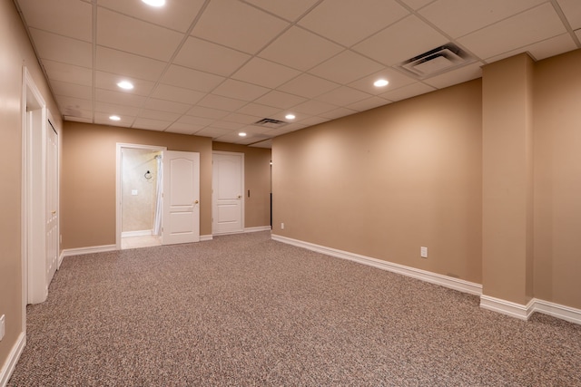 spare room featuring a paneled ceiling, recessed lighting, visible vents, and carpet floors