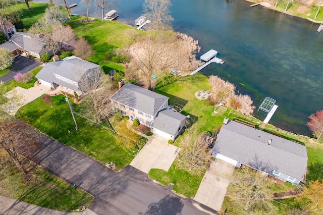 birds eye view of property with a residential view and a water view