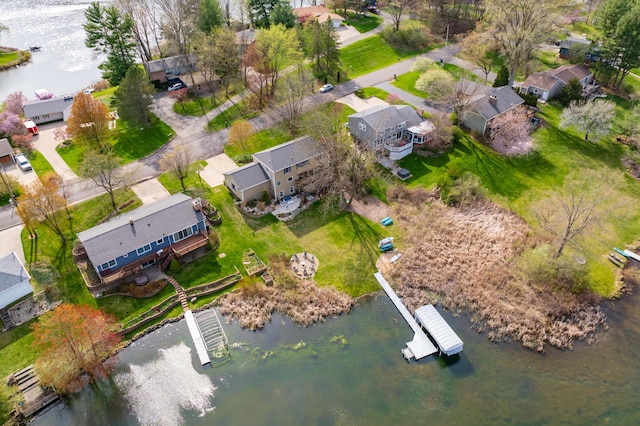 birds eye view of property featuring a water view and a residential view