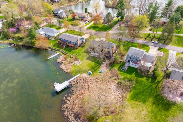 birds eye view of property featuring a water view and a residential view