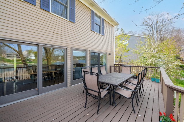 wooden deck featuring outdoor dining space