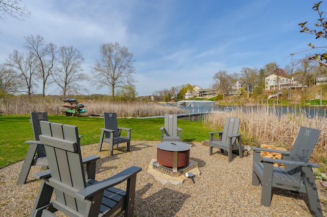 view of patio with a fire pit and a residential view