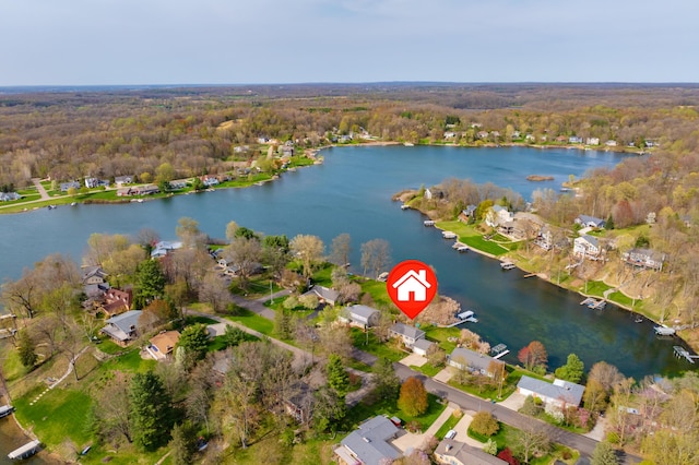 bird's eye view featuring a residential view, a view of trees, and a water view
