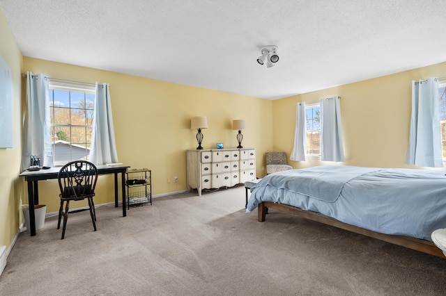 carpeted bedroom with baseboards